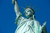 Fototapeta Miasta - Statue of Liberty, blue sky in New York