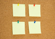 © Subtropicals - A few blank yellow stickers for taking notes on a cork board close-up.