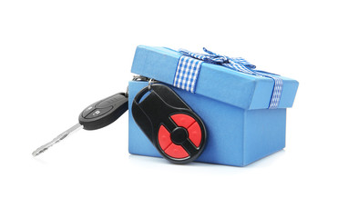 Wall Mural - Car keys and gift box on white background