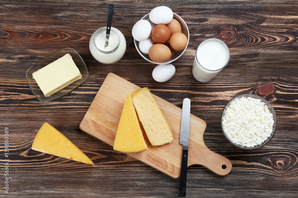Assortment of dairy products on wooden background