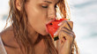 Girl eating watermelon, portrait.