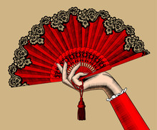 Female Hand With Red Open Fan
