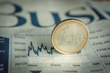 euro coin money (EUR), currency of European Union, Germany isolated over white business newspaper background