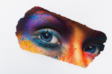Wall Mural - Eyes of model with colorful art make-up, close-up