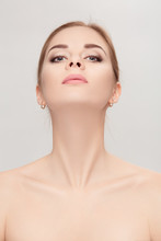  Portrait Of Female Neck On Grey Background Closeup. Girl With C