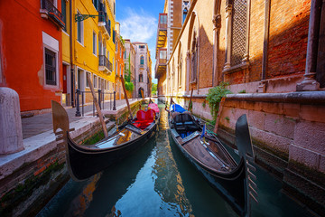 Fototapete - gondolas moored in narrow venetian canal