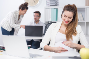 Wall Mural - Pregnant woman at work