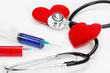 Stethoscope, syringe and heart. Health concept.