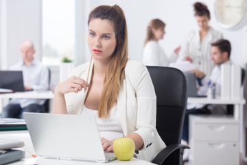 Wall Mural - Distracted pregnant woman at work