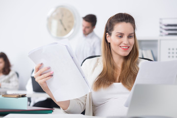 Wall Mural - Pregnant woman doing paperwork