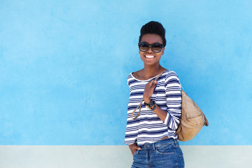 Wall Mural - cool young woman smiling with handbag