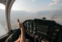 View From Cockpit Over City In Light Aircraft