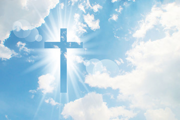 christian cross appears bright in the sky background