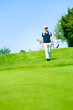© nullplus - Man Walking To His Golf Ball
