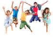 group of happy cheerful sportive children jumping and dancing