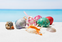 Easter On Tropical Beach Background. Eggs On The White Sand. Vacation And Travel Concept