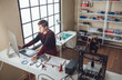 © LUMINA IMAGES - A man graphic designer working in his 3d printing studio.