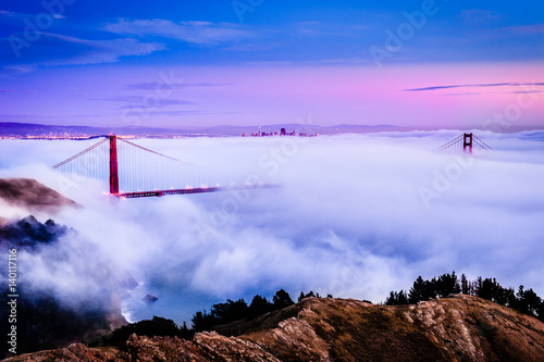 Golden Gate Bridge at dawn surrounded by fog from Marin Headlands in San Francis Plakát