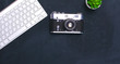 © lenetsnikolai - Top view of office graphic design pen mouse with laptop wireless mouse and vintage old camera on table. Concept graphic design workplace
