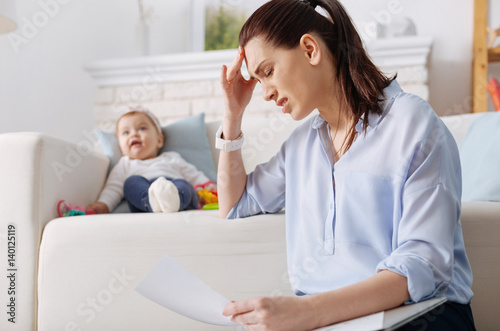 Fotomural Hardworking young mother suffering from exhaustion