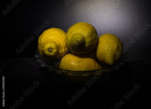 Fotografie, Obraz Still life lemons isolated on a dark black background