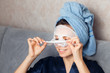 © Parilov - Girl puts a nourishing mask on the skin. Mask for rejuvenating and eliminating skin defects. Acne, acne. Young woman do masking