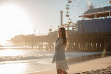 Soft Sunlight Makes Girl Glow On Beach Near Santa Monica Pier