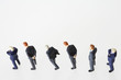 © Gudrun - Businessmen figurines standing in a row