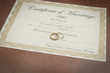 gold wedding rings with a marriage certificate 