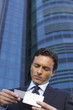 © STOCK4B  - Businessman watching a business card