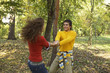 © STOCK4B  - Teenage girl and teenage boy holding hands while dancing in the forest, selective focus