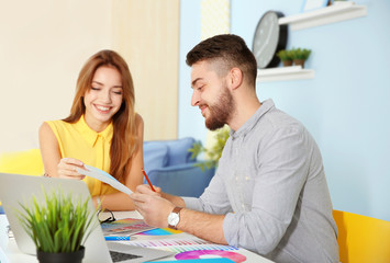 Sticker - Young decorators sitting at desk in office