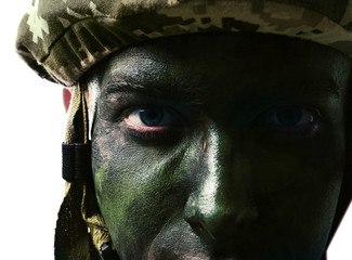 Wall Mural - Close up view of soldier with face paint on white background