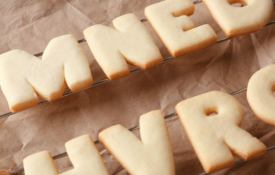Cookie alphabet on crumpled paper, closeup