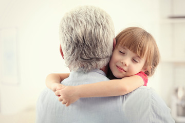 Poster - Girl embracing grand father at home