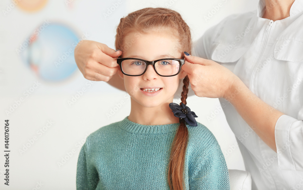 Cute little girl in ophthalmologist's office