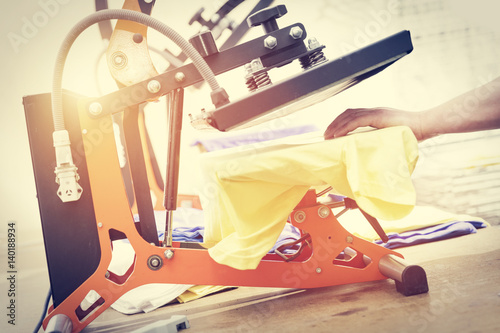 Fotografie, Obraz Preparing t-shirt for printing in the silk screen printing machine