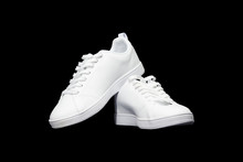 Full White Sneakers Isolated On Black Background