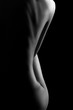 Sexy body nude woman. Naked sensual beautiful girl. Artistic black and white photo.