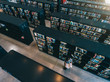© Jacob Lund - Female student at library bookshelf reading book