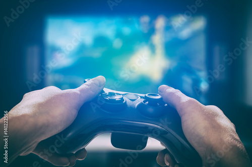 Foto Gaming game play video on tv or monitor. Gamer concept.
