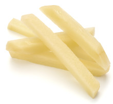 Raw Potato Sliced Strips Prepared For French Fries Isolated On White Background