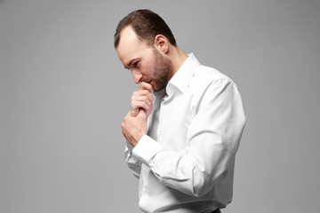 Wall Mural - Handsome depressed man on color background