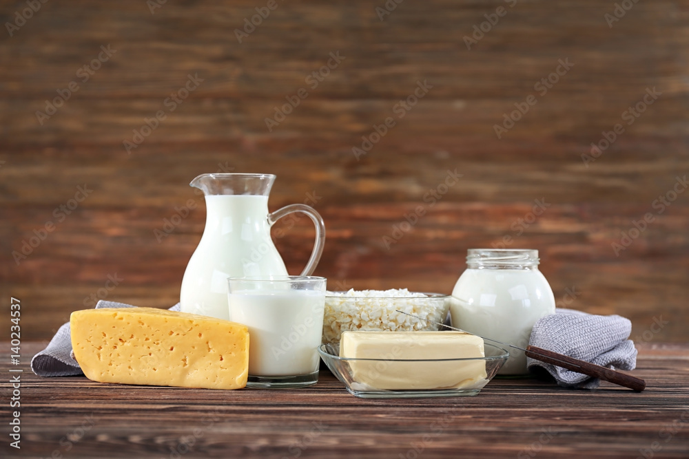 Different dairy products on wooden background