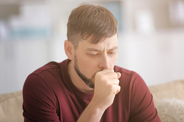 Young ill man at home