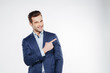 © Drobot Dean - Smiling business man pointing away