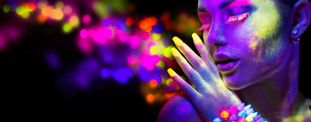 Wall Mural - Beauty woman in neon light, portrait of beautiful model with fluorescent makeup