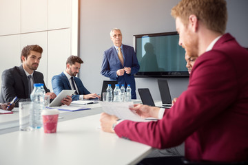 Sticker - Director with employers in meeting room