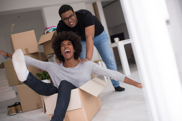 Wall Mural - African American couple  playing with packing material