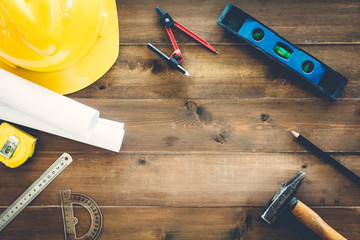 Construction tools  with helmet safety on wooden background